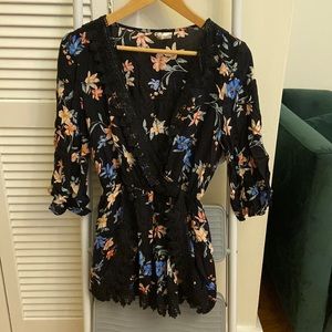 H&M black romper with colorful floral design